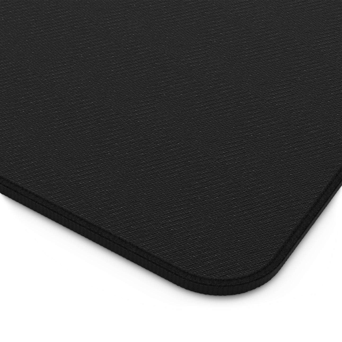 Black mouse pad with a textured surface on a white background