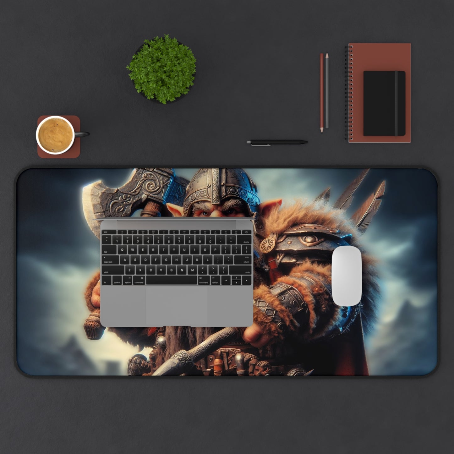 Desk setup with a large mouse pad featuring warrior design, keyboard, mouse, and stationery items.