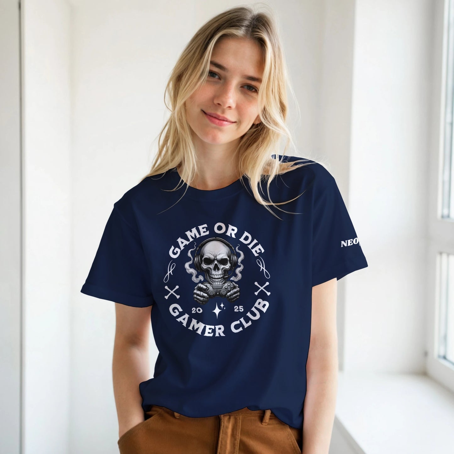 Woman wearing a navy blue t-shirt with a graphic design and text.