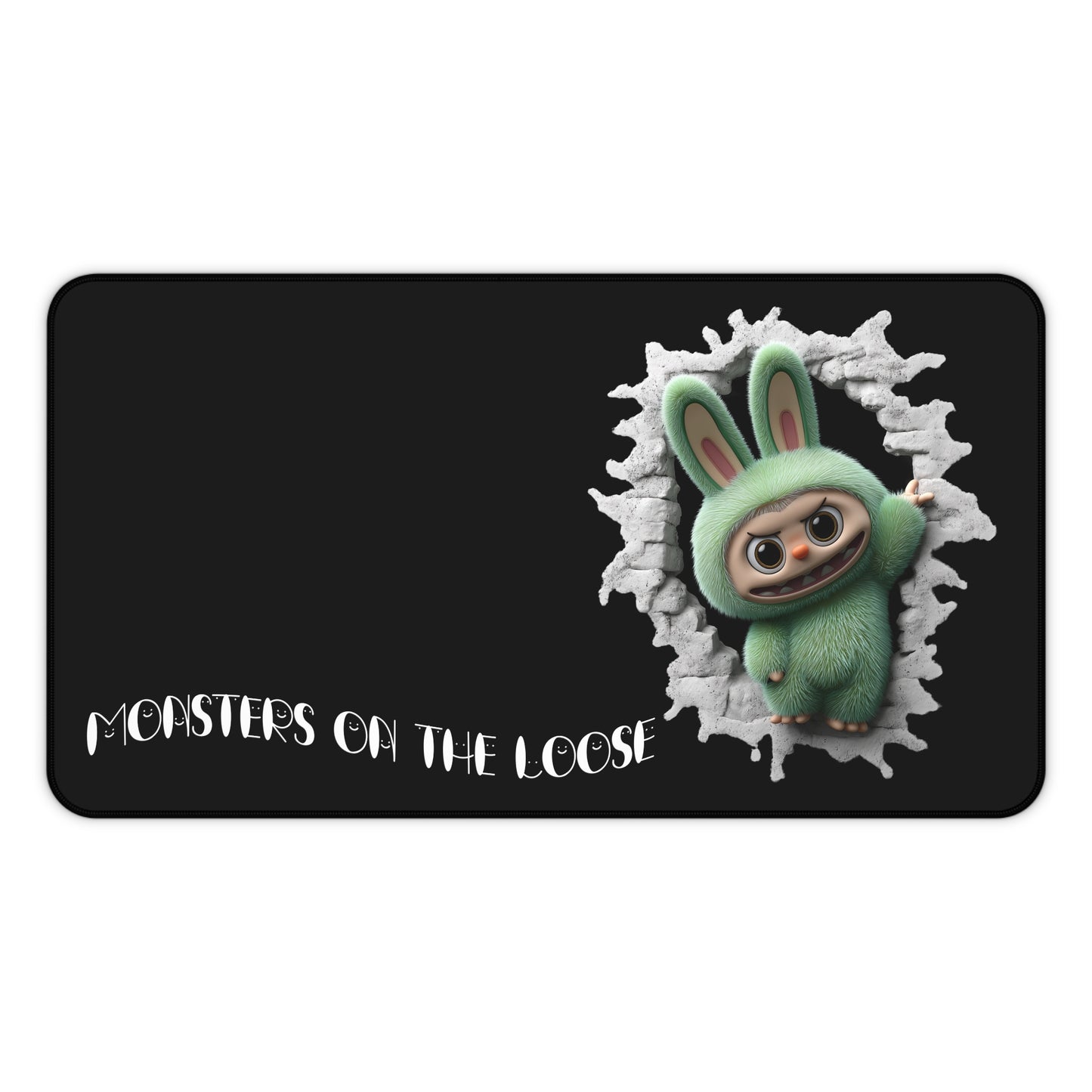 Green monster gaming mouse mat with 'Monsters on the Loose' text on a black background