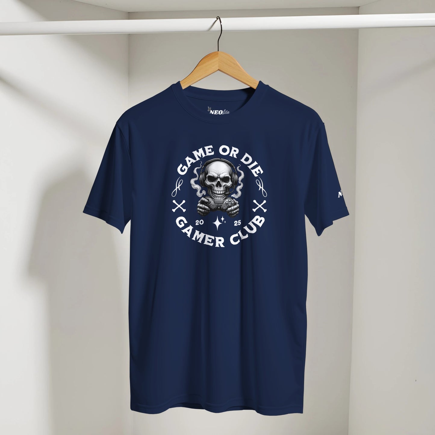 Navy blue t-shirt with skull graphic and text on a hanger against a white background