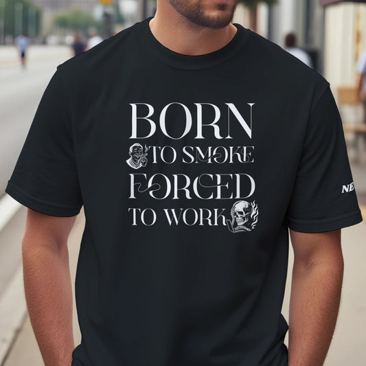 Man wearing a black t-shirt with text 'BORN TO SMOKE FORCED TO WORK' on a city street