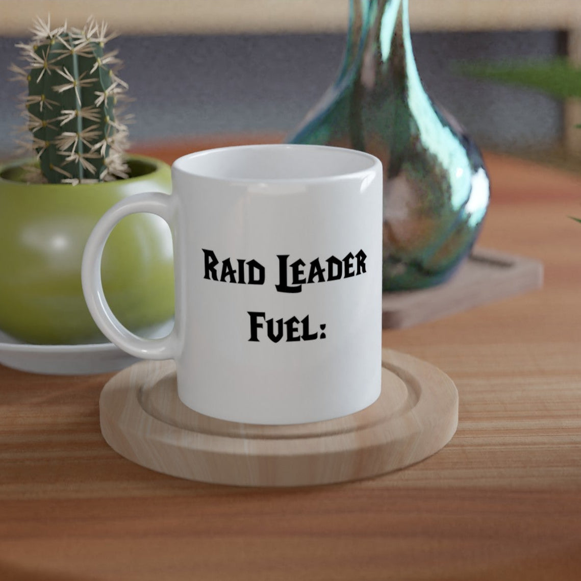 White mug with 'RAID LEADER FUEL:' text on a wooden coaster, with a cactus and vase in the background.
