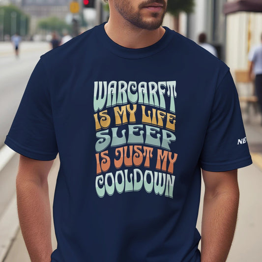 Man wearing a navy blue t-shirt with colorful text 'WARCRAFT IS MY LIFE SLEEP IS JUST MY COOLDOWN' on a city street.