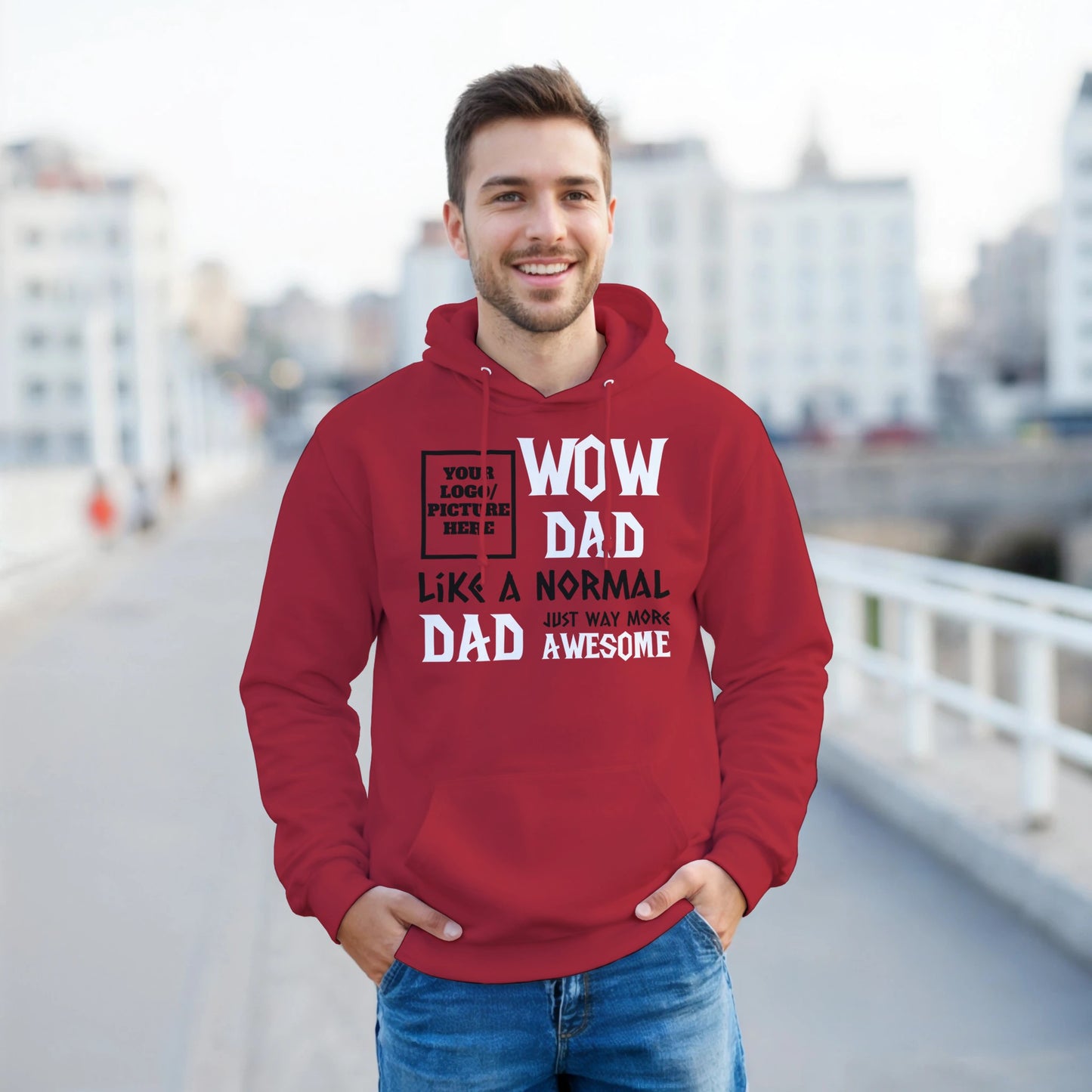 Man wearing a red hoodie with text, standing outdoors.