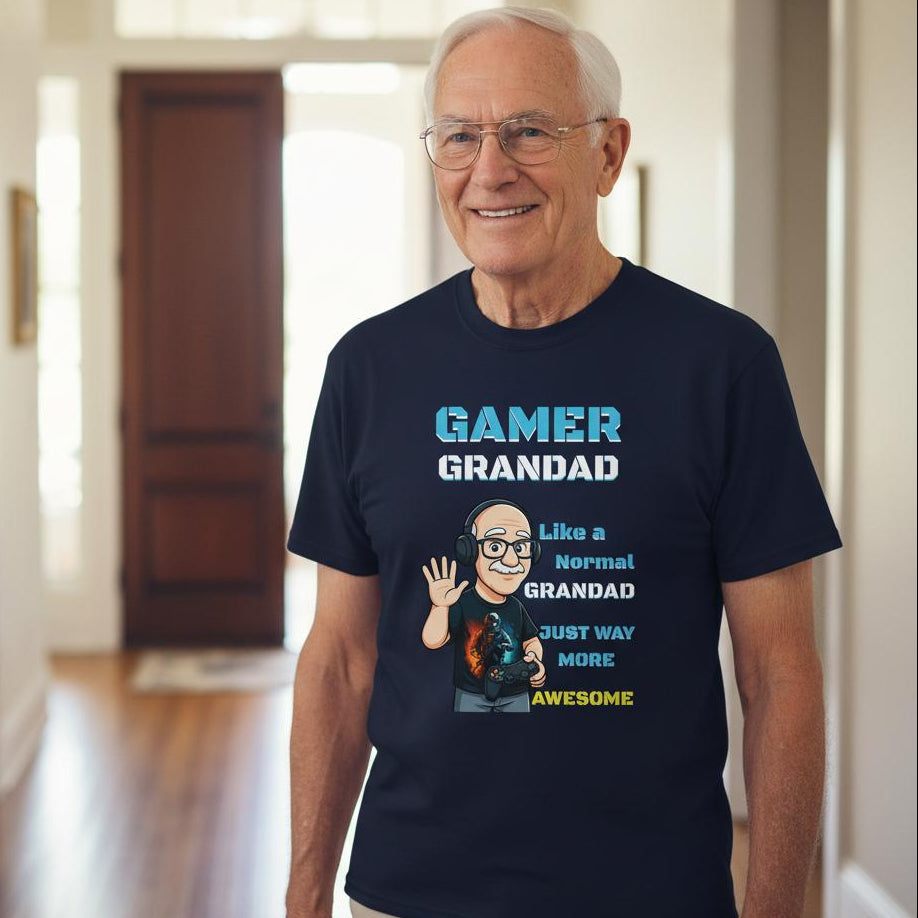 Man wearing a navy blue t-shirt with 'Gamer Grandad' text and graphic in a home setting.