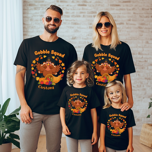 Family of four wearing matching black t-shirts with 'Gobble Squad Custom' design.