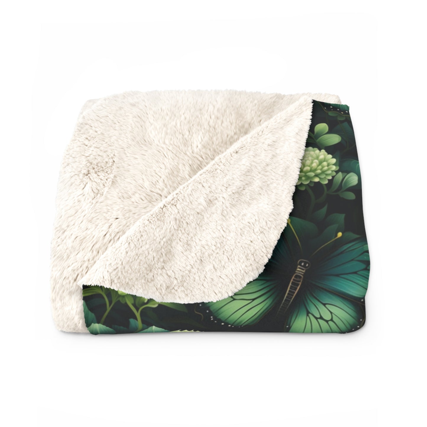folded green butterfly and flowers design sherpa fleece blanket, showing cosy and fluffy inside