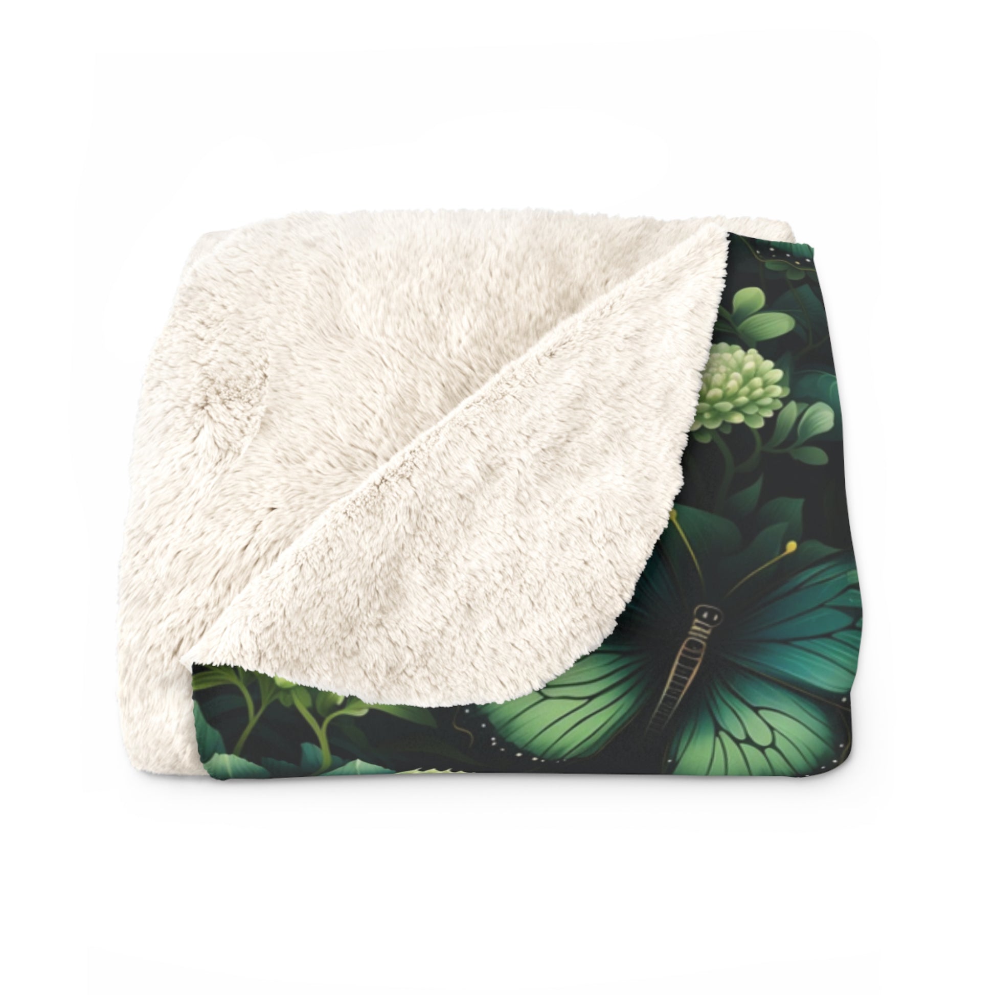folded green butterfly and flowers design sherpa fleece blanket, showing cosy and fluffy inside
