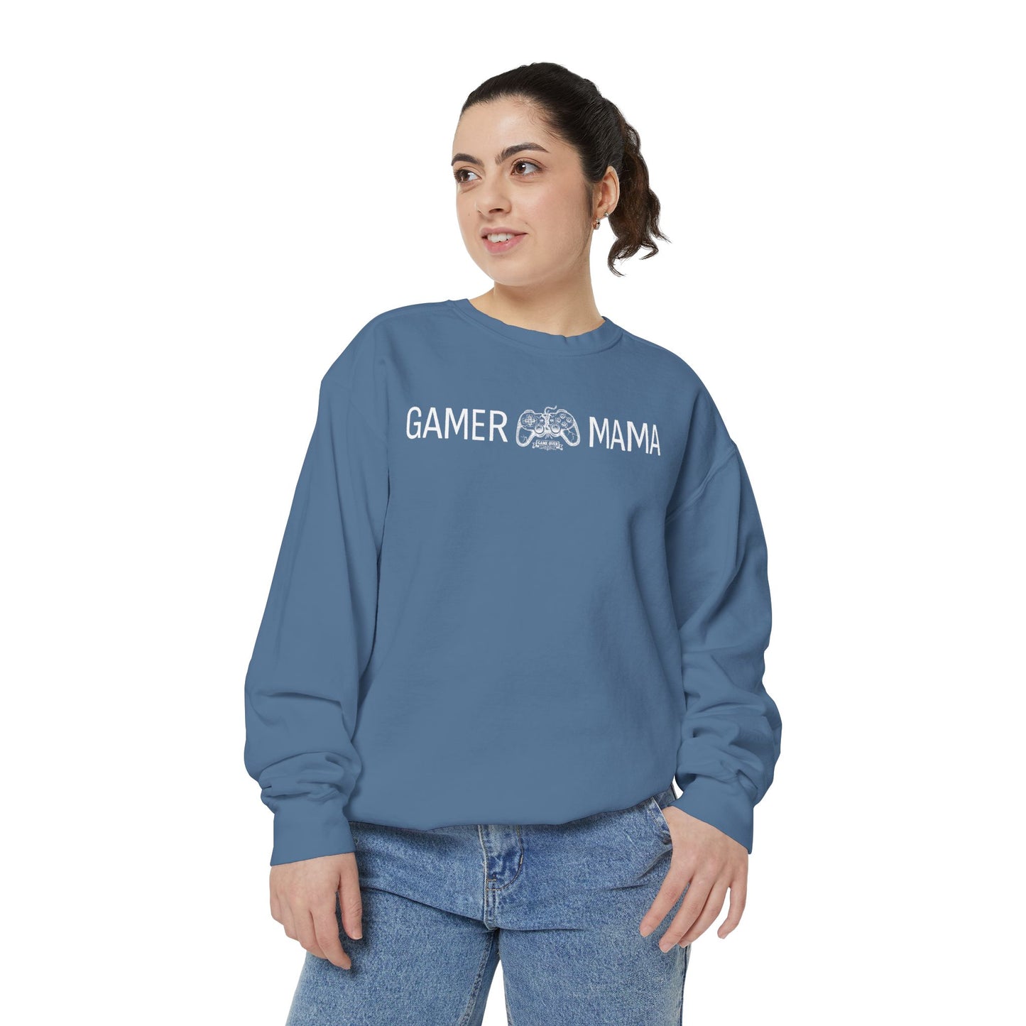 Woman wearing a blue sweatshirt with a white text 'Gamer MAMA' on a white background