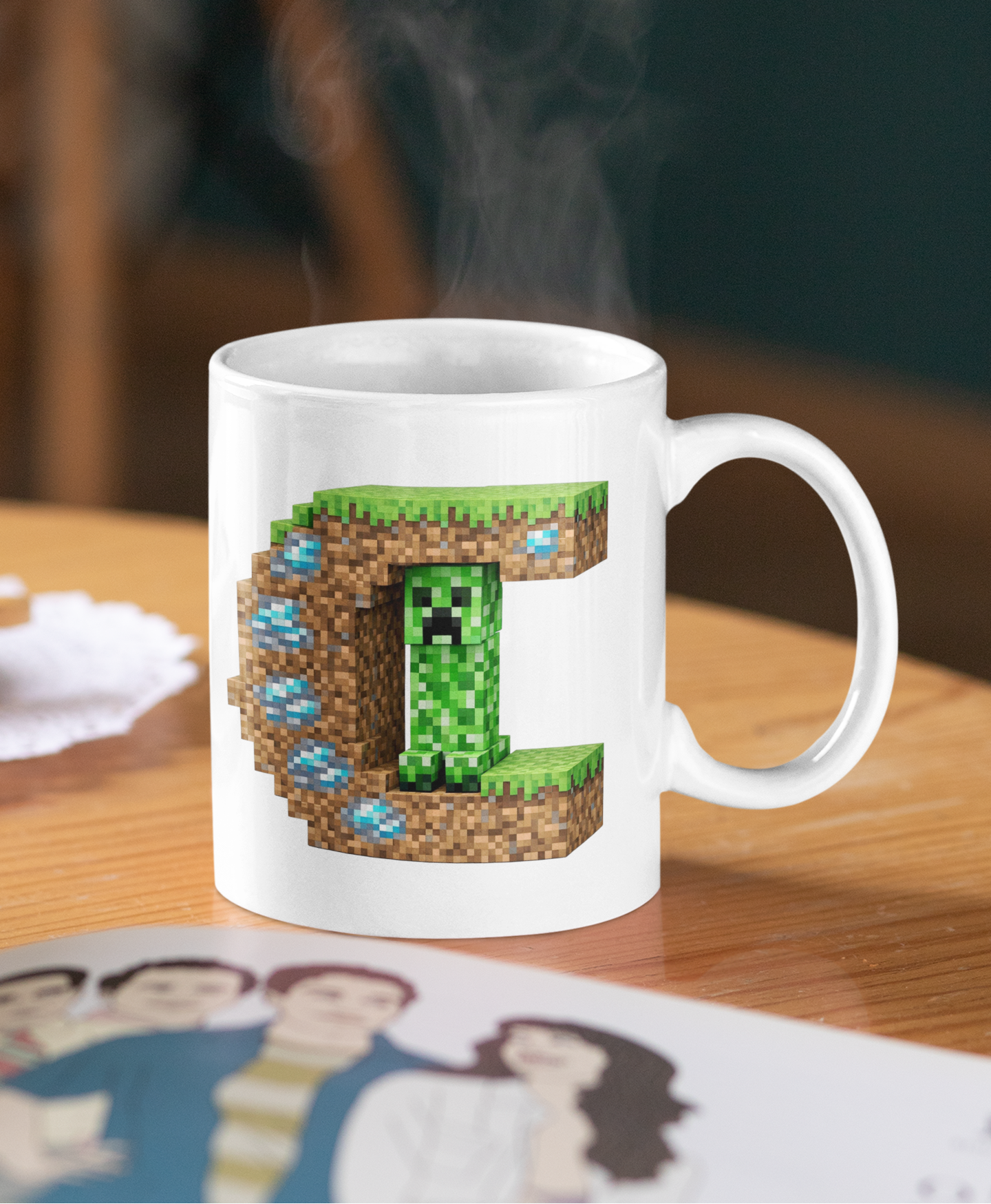 White mug with a pixelated creeper design on a wooden table